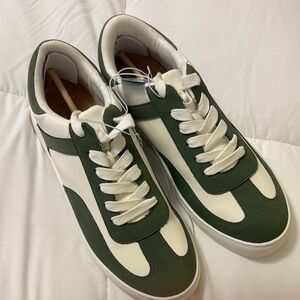 Green and white sneakers